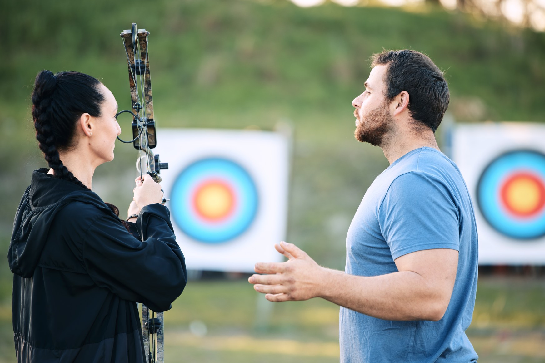 Beginner archer learning at an archery range