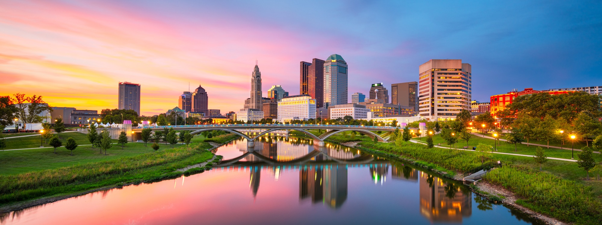 Columbus, Ohio skyline reflected in the Scioto River at sunset