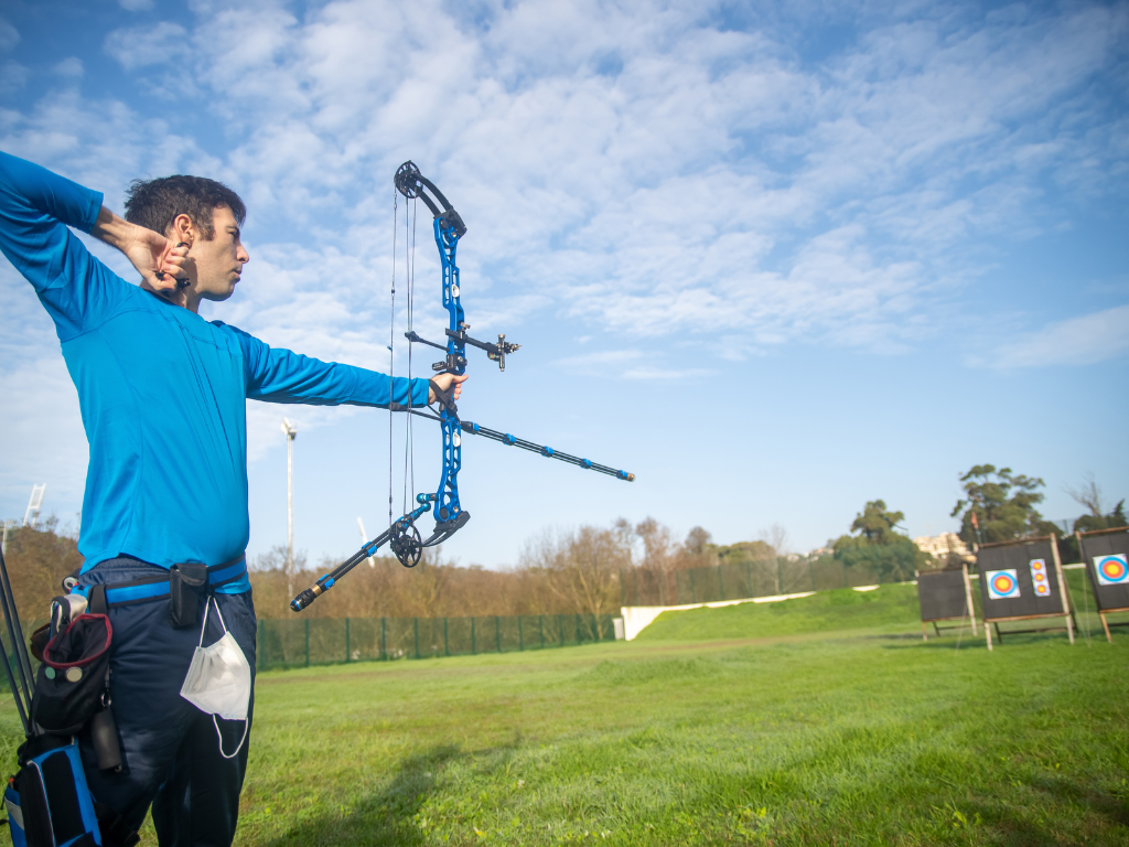 Archer holding follow-through position after release