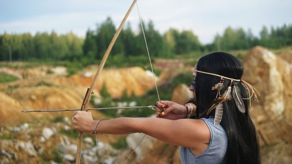 Traditional wooden bow and arrows outdoors