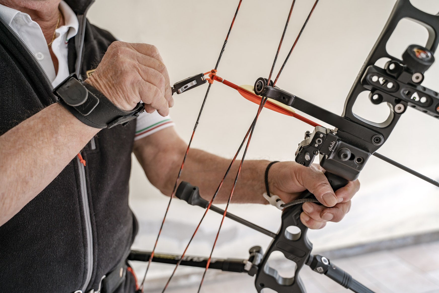 Recurve and compound bows side by side at an archery range